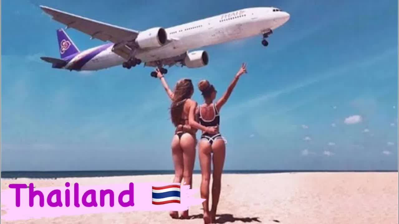 Phuket thailand beach , Planes land super low over beach.